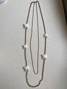 Long Double gold tone chain necklace featuring ivory white elephants 32” long